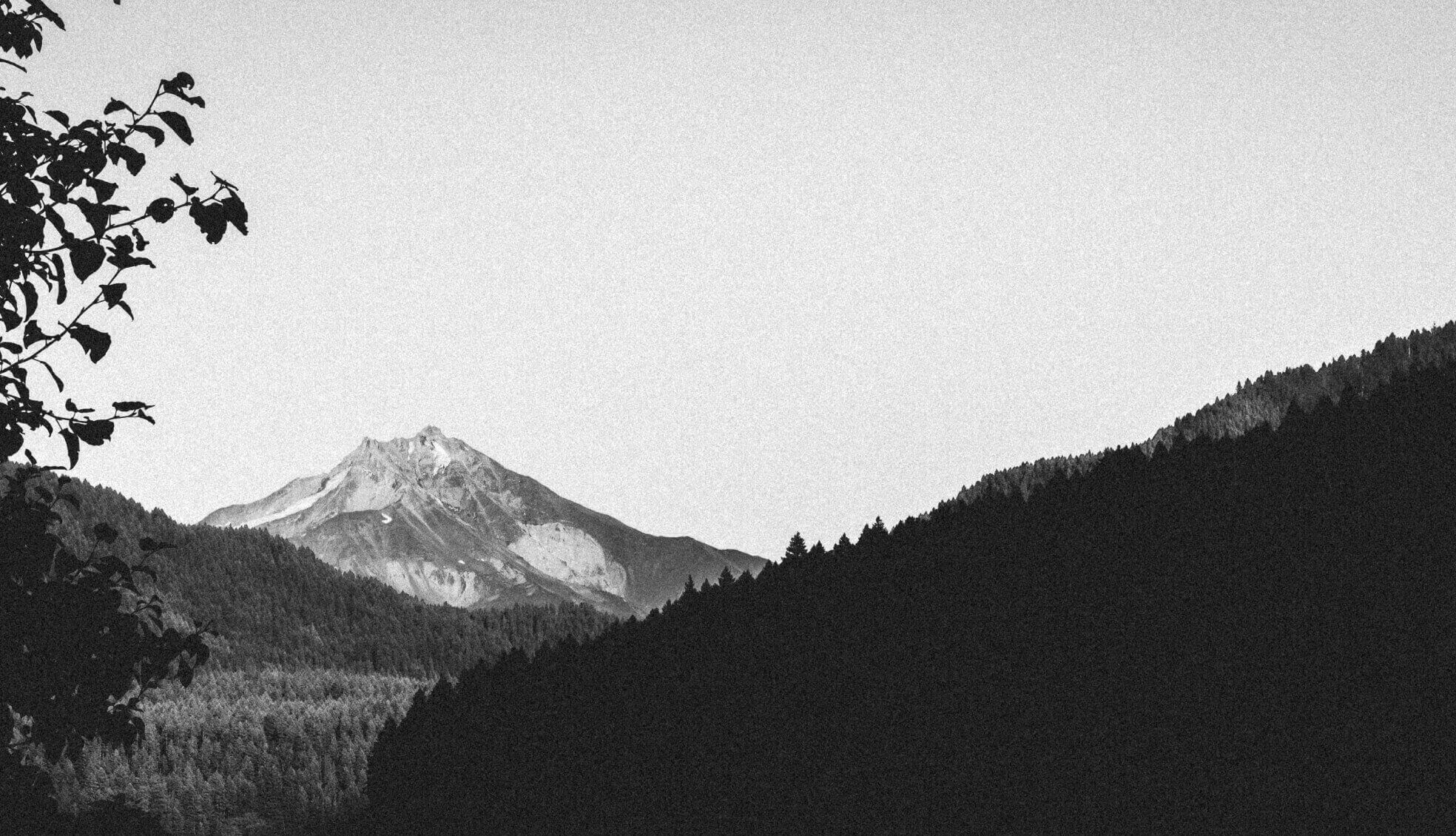 a grayscale image of mountains